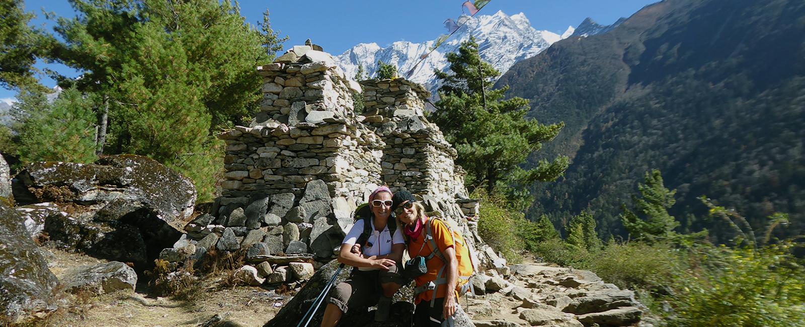 Trekker taking rest with beautiful view of mountain in background