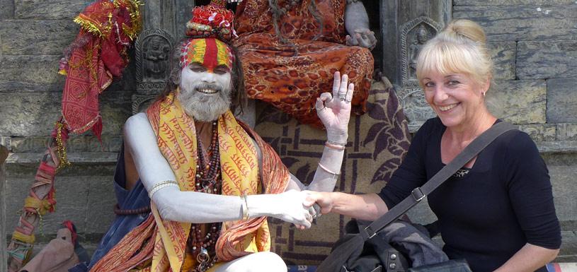 Guest taking photo with sadhu